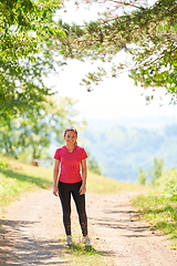 Image showing woman enjoying in a healthy lifestyle while jogging