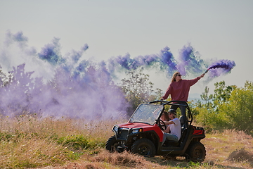 Image showing  colorful torches while driving a off road buggy car