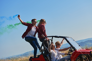 Image showing  colorful torches while driving a off road buggy car