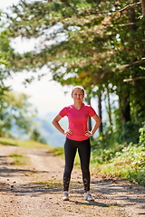 Image showing woman enjoying in a healthy lifestyle while jogging