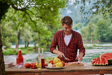 Image showing man cooking tasty food for french dinner party