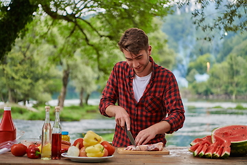 Image showing man cooking tasty food for french dinner party