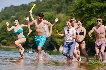 Image showing group of happy friends having fun on river