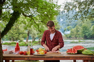 Image showing man cooking tasty food for french dinner party