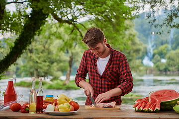 Image showing man cooking tasty food for french dinner party