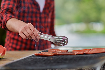 Image showing man cooking tasty food for french dinner party