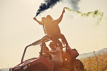 Image showing  colorful torches while driving a off road buggy car