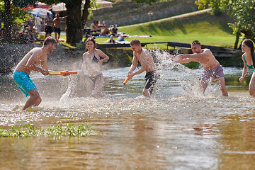 Image showing group of happy friends having fun on river