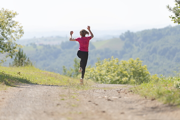 Image showing woman enjoying in a healthy lifestyle while jogging