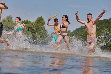 Image showing group of happy friends having fun on river