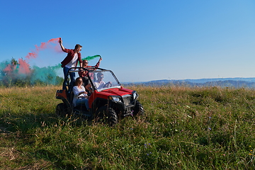 Image showing  colorful torches while driving a off road buggy car