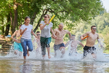 Image showing group of happy friends having fun on river