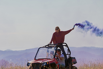 Image showing  colorful torches while driving a off road buggy car