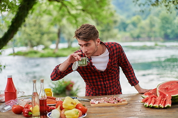 Image showing man cooking tasty food for french dinner party