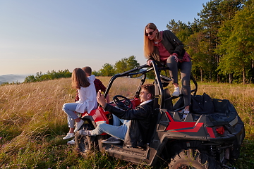 Image showing group young happy people enjoying beautiful sunny day while driving a off road buggy car