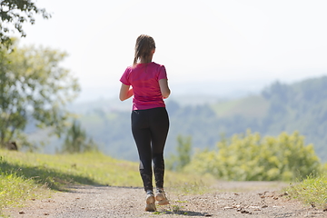 Image showing woman enjoying in a healthy lifestyle while jogging