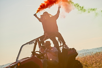 Image showing  colorful torches while driving a off road buggy car