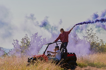 Image showing  colorful torches while driving a off road buggy car