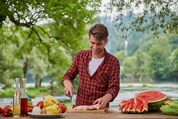 Image showing man cooking tasty food for french dinner party