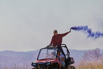 Image showing  colorful torches while driving a off road buggy car