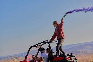 Image showing  colorful torches while driving a off road buggy car