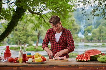 Image showing man cooking tasty food for french dinner party