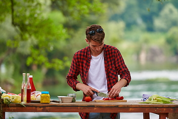 Image showing man cooking tasty food for french dinner party