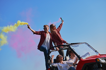 Image showing  colorful torches while driving a off road buggy car