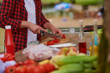 Image showing man cooking tasty food for french dinner party