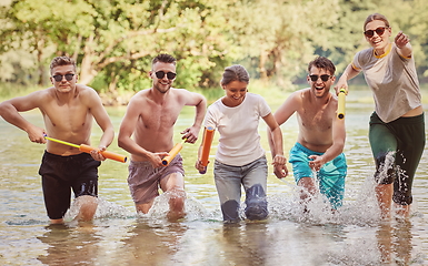 Image showing group of happy friends having fun on river