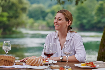 Image showing Girlfriend having picnic french dinner party outdoor