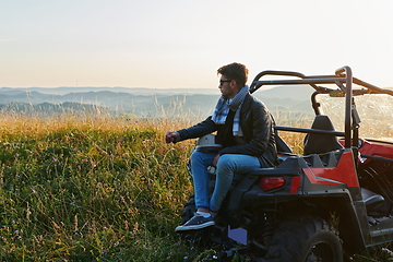 Image showing man enjoying beautiful sunny day while driving a off road buggy car