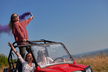 Image showing  colorful torches while driving a off road buggy car