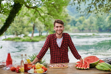 Image showing man cooking tasty food for french dinner party