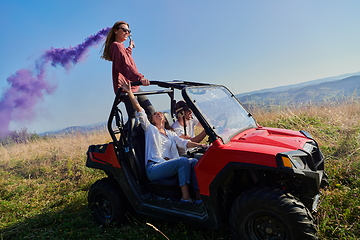 Image showing  colorful torches while driving a off road buggy car