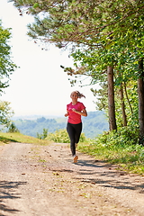 Image showing woman enjoying in a healthy lifestyle while jogging