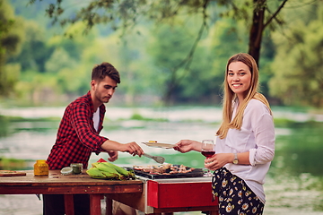 Image showing man cooking tasty food for french dinner party