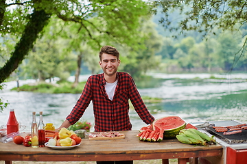 Image showing man cooking tasty food for french dinner party