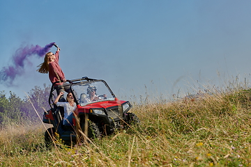 Image showing  colorful torches while driving a off road buggy car