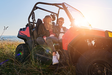 Image showing couple enjoying beautiful sunny day while driving a off road buggy