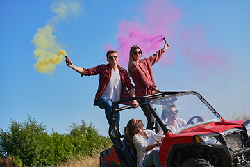 Image showing  colorful torches while driving a off road buggy car