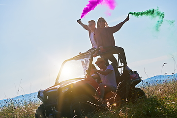 Image showing  colorful torches while driving a off road buggy car