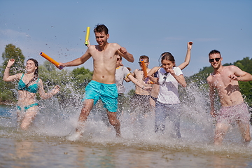 Image showing group of happy friends having fun on river