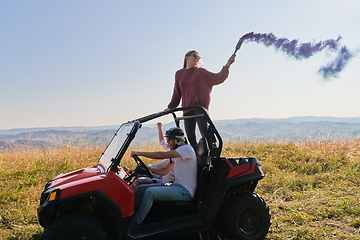 Image showing  colorful torches while driving a off road buggy car