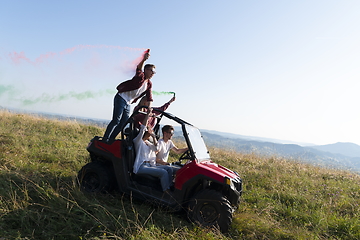 Image showing  colorful torches while driving a off road buggy car