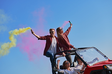 Image showing  colorful torches while driving a off road buggy car