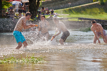 Image showing group of happy friends having fun on river