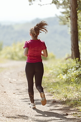 Image showing woman enjoying in a healthy lifestyle while jogging