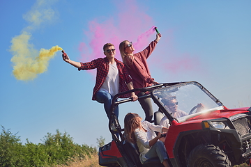 Image showing  colorful torches while driving a off road buggy car