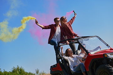 Image showing  colorful torches while driving a off road buggy car